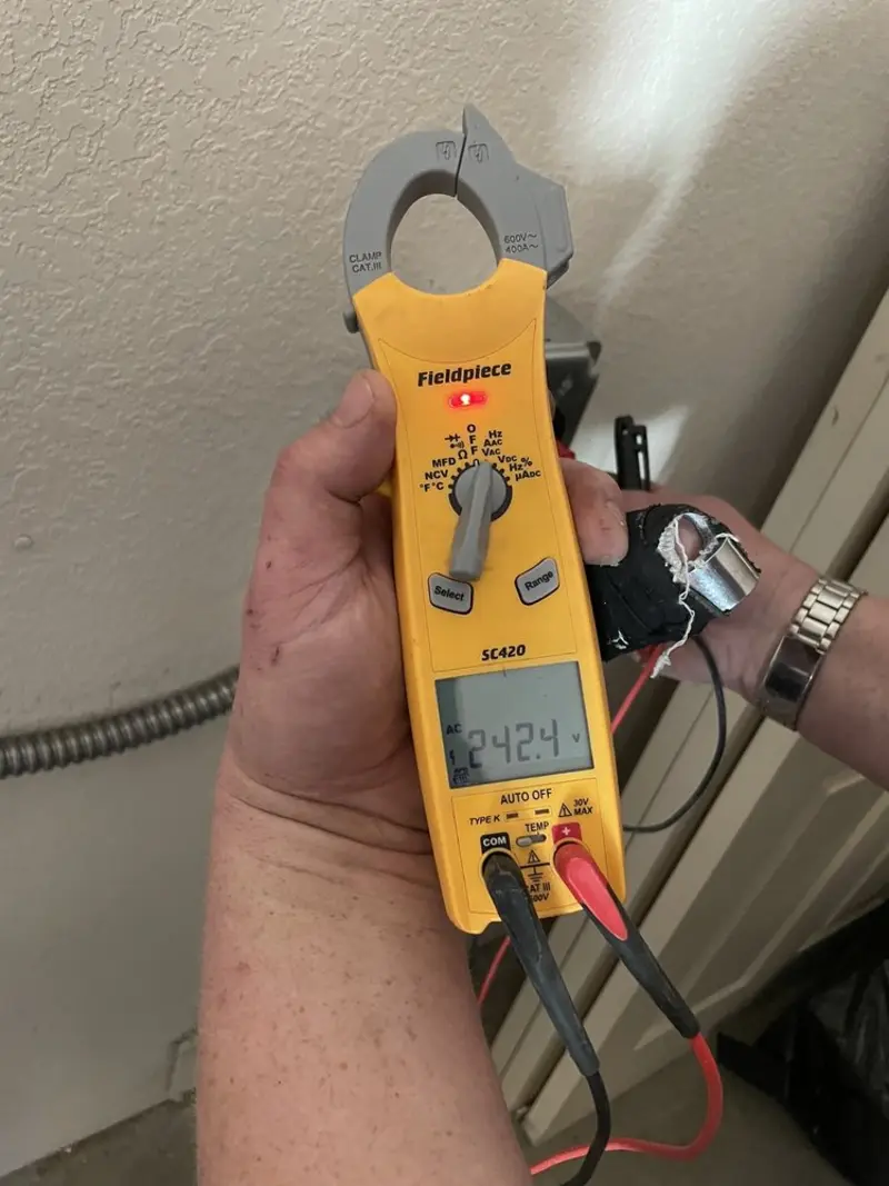 Voltage testing with clamp meter during Electrical Installation Services in Chalfont